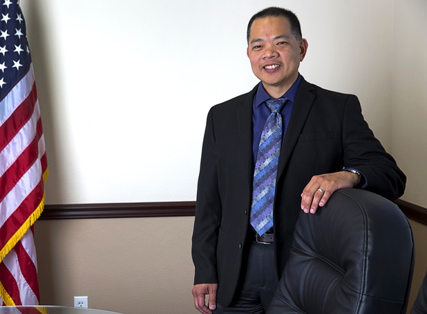 Sonny Vinuya, president of the Asian Chamber of Commerce, poses in a conference room at Nevada State Bank Tuesday, March 22, 2016. Vinuya is also a vice president/ small business relationship manager at the bank.