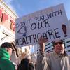A union member holds a sign critical of billionaire investor Carl Icahn during a demonstration outside the Trump Taj Mahal casino in Atlantic City, N.J., on Wednesday March 23, 2016, to protest Icahn's refusal to reinstate health insurance and pension benefits that previous owners eliminated in bankruptcy court before Icahn acquired the casino last month. Icahn, the billionaire investor, accuses Local 54 of the Unite-HERE union, of trying to force the Taj Mahal to close by saddling it with unaffordable financial demands.