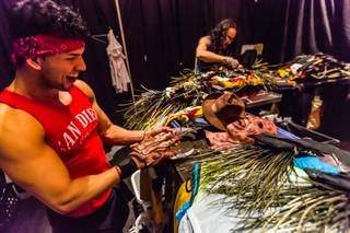 Cast member Alejandro Granados tries on his Freddy Krueger gloves as stylist and costume Designer Jeffrey Debarathy works during rehearsal for the new Chippendales show “53X” at Chateau on Thursday, March 10, 2016, at Paris Las Vegas.
