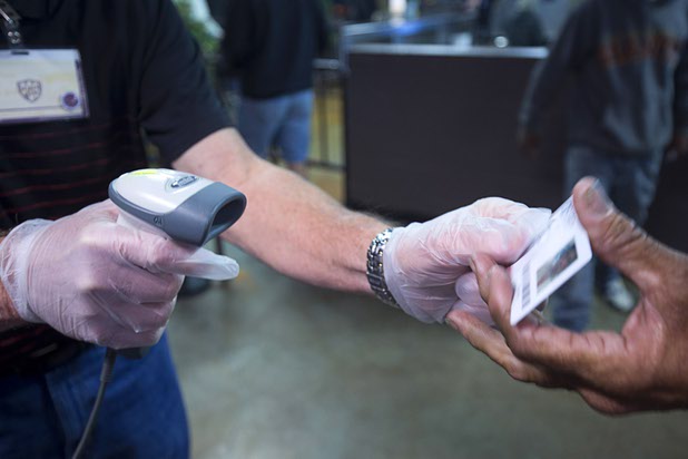 A man has his Clarity Card scanned as he lines up for a meal at the St. Vincent Lied Dining Facility at Catholic Charities of Southern Nevada Tuesday, March 29, 2016. The Clarity Card system is a way of gathering data for grant-based charities.