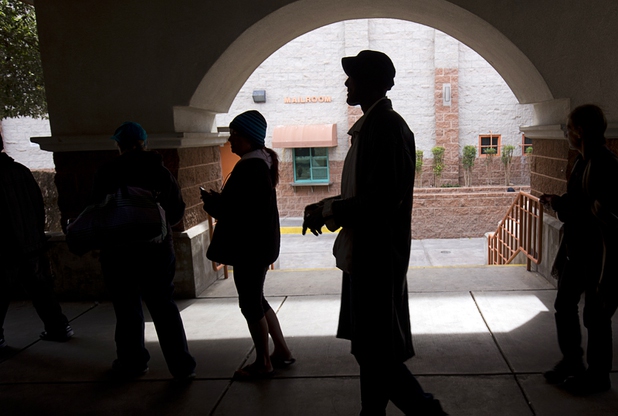 People line up for a meal outside the St. Vincent Lied Dining Facility at Catholic Charities of Southern Nevada Tuesday, March 29, 2016. The charity offers a free meal once a day but also offers a low-cost breakfast and lunch.