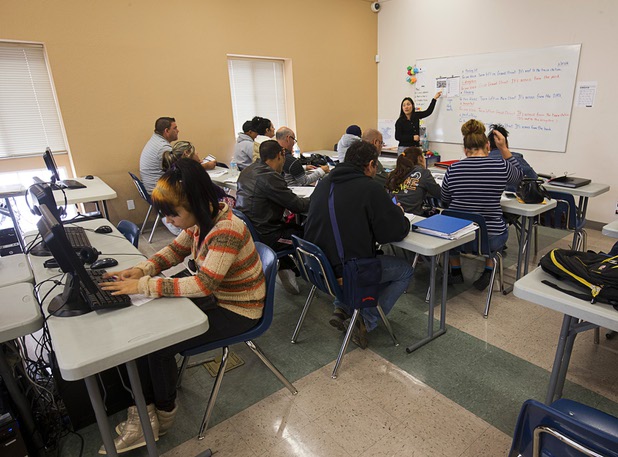 English as a Second Language teacher Ratchada Scott teaches a class in a computer lab at Catholic Charities of Southern Nevada Tuesday, March 29, 2016. Many of the students are refugees.