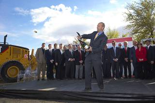 Eric Davison, fine wine portfolio manager for Southern Wine and Spirits, sabers the cork off of a magnum of Moet Chandon Imperial champagne during a groundbreaking ceremony for Hospitality Hall on UNLV campus Wednesday, March 30, 2016.