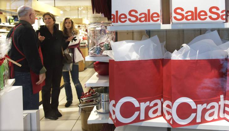 Shoppers talk with an employee inside the Crate and Barrel store on the Magnificent Mile in Chicago in this Associated Press file photo. 