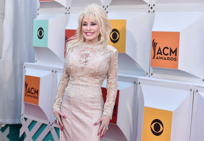 Dolly Parton arrives at the 51st annual Academy of Country ...