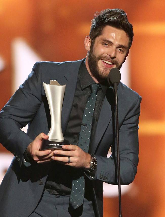 Thomas Rhett accepts the award for Single Record of the Year for “Die a Happy Man” during the 51st annual Academy of Country Music Awards on Sunday, April 3, 2016, at MGM Grand Garden Arena.