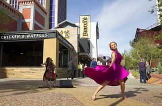 A dancer performs during the grand opening of The Park Monday, April 4, 2016. The new pocket park, lined with restaurants and seating for outdoor dining, runs from the Las Vegas Strip to the new T-Mobile Arena.