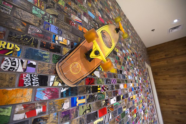 A wall made from recycled skateboards is shown at California Pizza Kitchen during the grand opening of The Park Monday, April 4, 2016. The new pocket park, lined with restaurants and seating for outdoor dining, runs from the Las Vegas Strip to the new T-Mobile Arena.