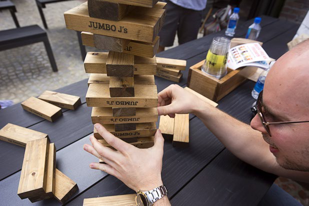 A guest plays Jenga at a Beerhaus outdoor seating area during the grand opening of The Park Monday, April 4, 2016. The new pocket park, lined with restaurants and seating for outdoor dining, runs from the Las Vegas Strip to the new T-Mobile Arena.