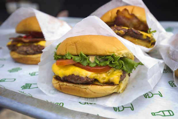 Cheeseburgers from Shake Shack are displayed during the grand opening of The Park Monday, April 4, 2016. The new pocket park, lined with restaurants and seating for outdoor dining, runs from the Las Vegas Strip to the new T-Mobile Arena.