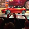 Tesla Motors unveils the new, lower-priced Model 3 sedan at the Tesla Motors design studio Thursday, March 31, 2016, in Hawthorne, Calif.