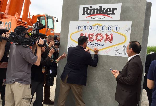 Nevada Gov. Brian Sandoval signs a concrete culvert that will be incorporated into Project Neon, the massive roadway construction project that will reshape traffic flow between Sahara Avenue and the Spaghetti Bowl. Sandoval attended the groundbreaking event Thursday, April 7, 2016, at Symphony Park.

