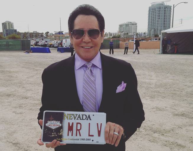 Wayne Newton holds a commemorative license plate presented to him Thursday, April 7, 2016, by Gov. Brian Sandoval at Project Neon in Symphony Park downtown.