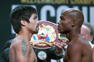 Manny Pacquiao, left, and Timothy Bradley Jr. face off during their official weigh-in at MGM Grand Garden Arena Friday, April 8, 2016. The welterweight boxers will meet for their third fight at the arena on Saturday.