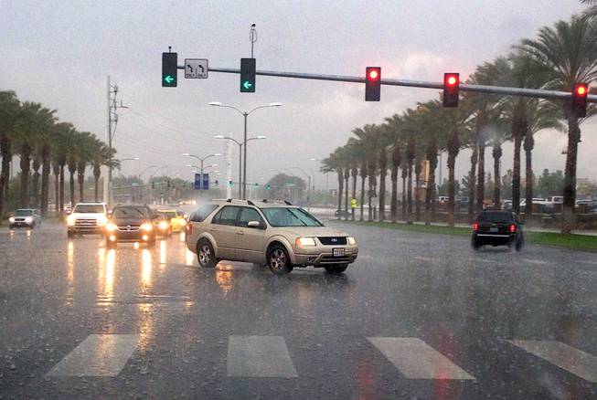 Traffic is shown in heavy rain on Green Valley Parkway in Henderson Saturday, April 9, 2016.