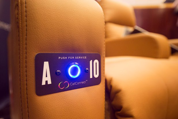 A service button is shown in a movie theater seat at the CallConnect booth during the CinemaCon trade show at Caesars Palace Wednesday, April 13, 2016. The service buttons are becoming popular at upscale, dine-in movie theaters.