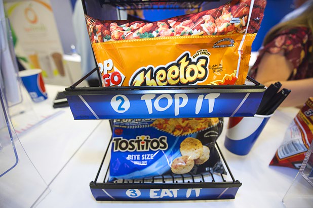 Top N Go Cheetos and Tostitos are displayed during the CinemaCon trade show at Caesars Palace Wednesday, April 13, 2016. The packaging acts as a bowl so consumers can top the chips with a variety of toppings.