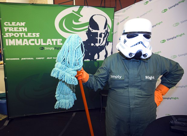 A "Space Janitor" wears a stormtrooper helmet at the SimplyRight booth during the CinemaCon trade show at Caesars Palace Wednesday, April 13, 2016. The Ogden, Utah-based company offers a variety of janitorial and cleaning services.