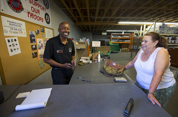 Thomas McClain, left, program manager is shown in the Framing Hope Warehouse at HELP of Southern Nevada Thursday, April 14, 2016. Cynthia Baca, executive director of Rebuilding Together Southern Nevada, is at right. Donated materials and supplies are sold to other local nonprofits. The warehouse is not open to the public.