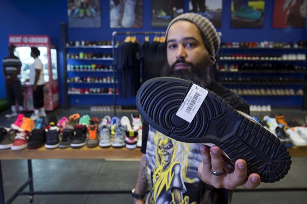 Owner Jaysse Lopez shows the price tag on a rare pair of Nike "Nightmare on Elm Street" (Freddy Krueger Dunk SB) prototype sneakers at Urban Necessities in the Boulevard mall Sunday, April 17, 2016. The price is $6,200.00.