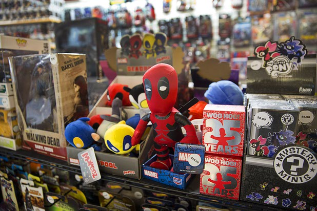 A Deadpool plush figure, center, is displayed at The Pop Shack in the Boulevard mall Sunday, April 17, 2016.