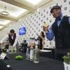 Quincy Richardson, right, poses with a "Dragon Cool" cocktail during the Wine & Spirits Wholesalers of America (WSWA) convention at Caesars Palace Wednesday, April 20, 2016.