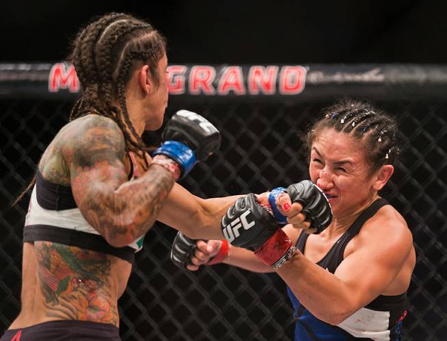 Womens Strawweight Juliana Lima strikes the face Carla Esparza during ...