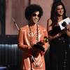 In this Feb. 8, 2015, file photo, Prince presents the award for album of the year at the 57th annual Grammy Awards in Los Angeles. Beyond dance parties and hit songs, Prince’s legacy included black activism. He said black lives matter before presenting a 2015 Grammy.