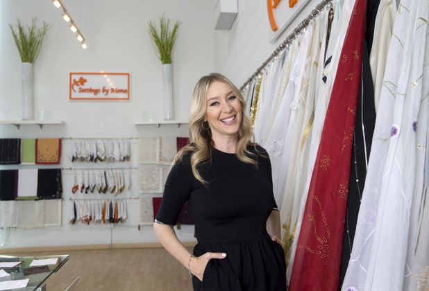 Mona Steck, owner of Settings by Mona, a luxury linen company that specializes in hand embroidered/tailored table and bed linens, poses in her showroom Wednesday, April 27, 2016.