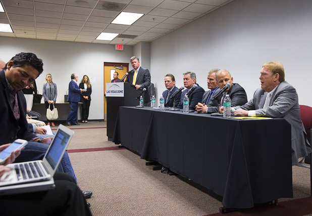 Oakland Raiders owner Mark Davis, right, responds to a question during a news conference following a meeting of the Southern Nevada Tourism Infrastructure Committee at UNLV Thursday, April 28, 2016.
