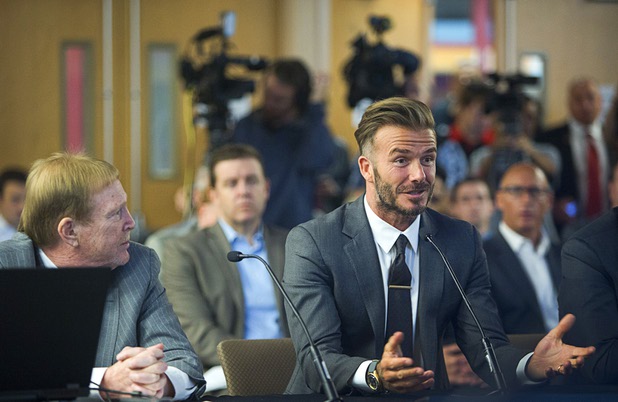 Oakland Raiders owner Mark Davis, listens to soccer star David Beckham during a meeting of the Southern Nevada Tourism Infrastructure Committee at UNLV Thursday, April 28, 2016.