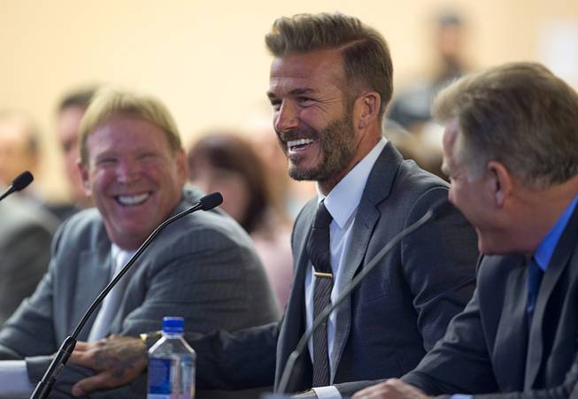 Soccer star David Beckham, center, smiles during a meeting of the Southern Nevada Tourism Infrastructure Committee at UNLV Thursday, April 28, 2016. Oakland Raiders owner Mark Davis is at left.