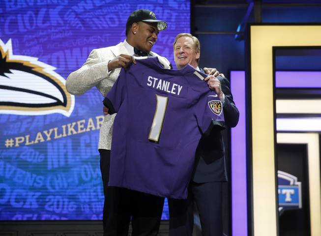 Notre Dame’s Ronnie Stanley poses for photos with NFL Commissioner Roger Goodell after being selected by Baltimore Ravens as the sixth pick in the first round of the 2016 NFL football draft, Thursday, April 28, 2016, in Chicago. 