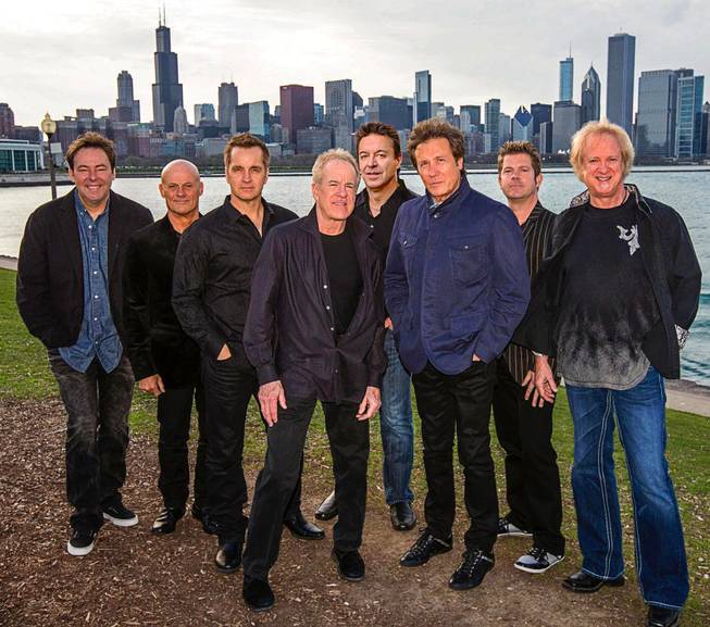 The current lineup of Chicago — which was originally called the Chicago Transit Authority — is seen with the Chicago skyline in the backdrop.