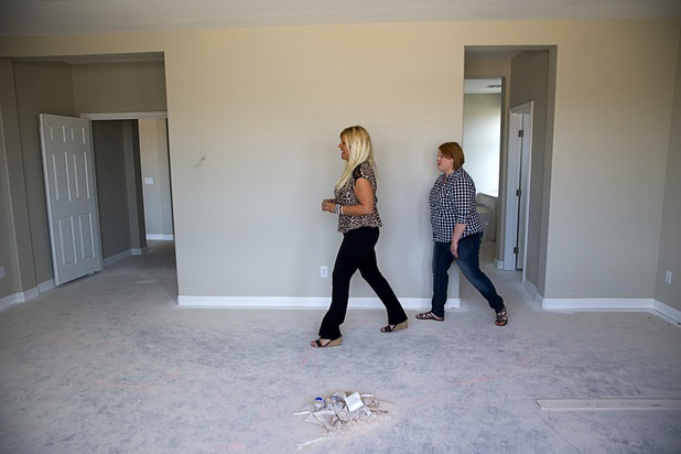 Real estate agent Clea Whitney takes Jennifer Farnsworth through a home under construction at the Valley Heights by Elation Homes subdivision Wednesday, May 4, 2016, in Moapa Valley. Farnsworth is interested in buying a home in the subdivision, she said.