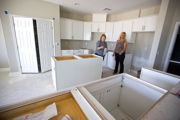 Jennifer Farnsworthlooks over a kitchen in a home under construction with real estate agent Clea Whitney at the Valley Heights by Elation Homes subdivision Wednesday, May 4, 2016, in Moapa Valley. Farnsworth is interested in buying a home in the subdivision, she said.