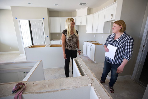 Real estate agent Clea Whitney talks with Jennifer Farnsworth in a home under construction at the Valley Heights by Elation Homes subdivision Wednesday, May 4, 2016, in Moapa Valley. Farnsworth is interested in buying a home in the subdivision, she said.