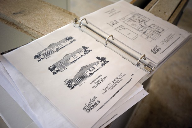 A book shows illustrations of options at the Valley Heights by Elation Homes subdivision Wednesday, May 4, 2016, in Moapa Valley.