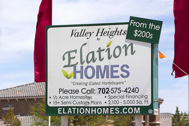 A sign advertises the Valley Heights by Elation Homes subdivision Wednesday, May 4, 2016, in Moapa Valley.