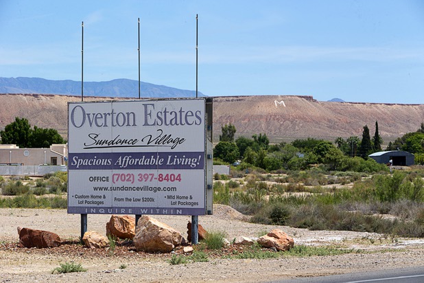 A sign advertises a residential development Wednesday, May 4, 2016, in Moapa Valley.