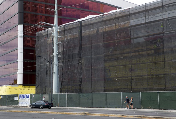 Pedestrians pass by the Lucky Dragon hotel-casino under construction on Sahara Avenue near Las Vegas Boulevard Thursday, May 5, 2016.