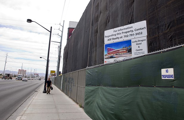A pedestrian passes by the Lucky Dragon hotel-casino under construction on Sahara Avenue near Las Vegas Boulevard Thursday, May 5, 2016.