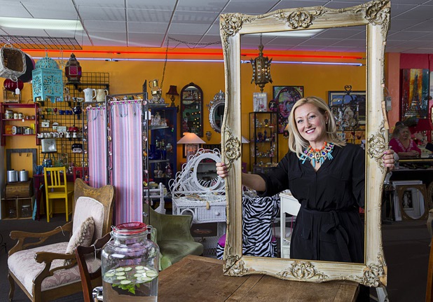 Natasha Pace of Silver Lining Estate Sales poses at Gypsy Bazaar, a friend's vintage resale shop, Thursday, May 5, 2016.
