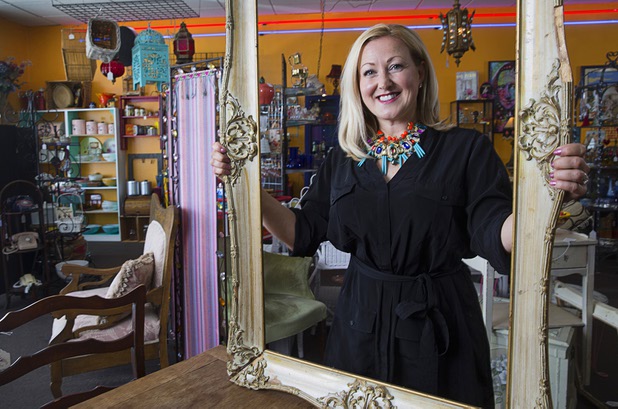 Natasha Pace of Silver Lining Estate Sales poses at Gypsy Bazaar, a friend's vintage resale shop, Thursday, May 5, 2016.