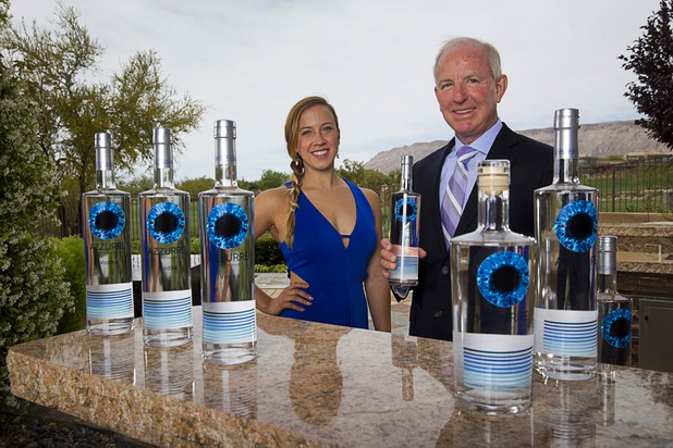 Angela Pettit and her father Danny Pettit pose with bottles of Azzurre Vodka Thursday, May 5, 2016. Azzurre Spirits, started in 2014, sells ultra-premium vodka and gin brand made with natural ingredients, such as apples, grapes and sugar cane.