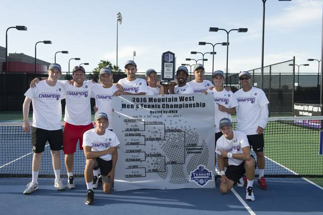 The UNLV men's tennis team holds its trophy and bracket after winning the 2016 Mountain West Championship on Sunday, May 1 at UNLV's Frank and Vicki Fertitta Tennis Complex.