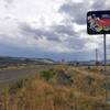 A "welcome to Nevada" sign is shown on State Route 225 at the northern Nevada border with Idaho.