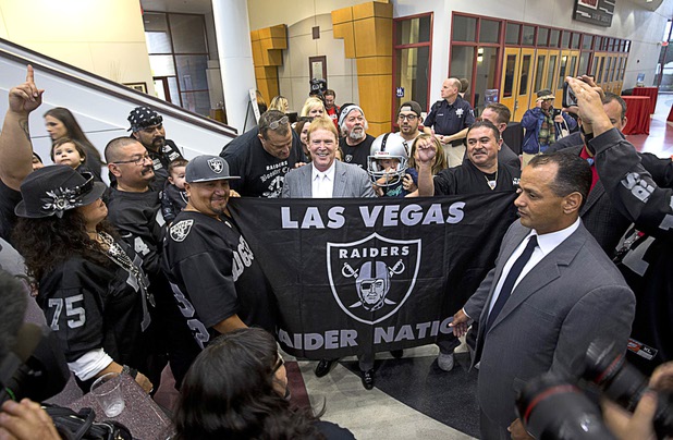 Oakland Raiders owner Mark Davis stands with local Raiders fans after a meeting of the Southern Nevada Tourism Infrastructure Committee on Thursday, April 28, 2016, at UNLV.