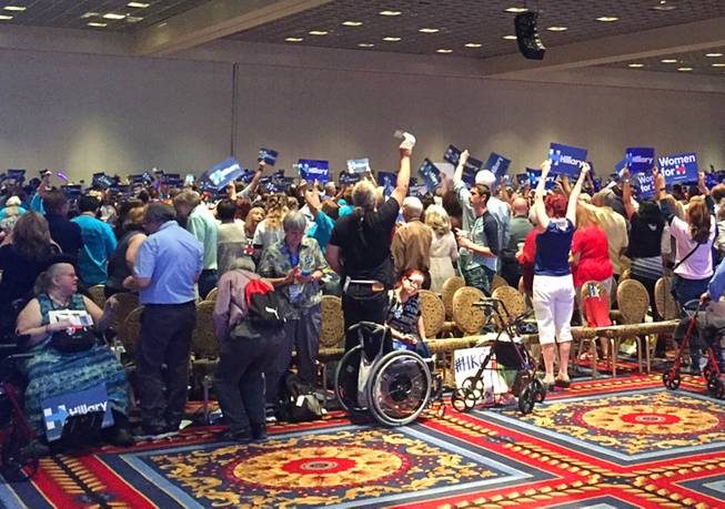 Bernie Sanders and Hillary Clinton supporters attend Saturday's state Democratic Party convention at the Paris Hotel in Las Vegas.