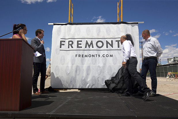 Nate Carlson (second left), vice president of development for the Wolff Company, Todd Kessler of Resort Gaming Group and Tim Wolff, executive vice president of development for the Wolff Company, unveil the name of the apartment complex during groundbreaking ceremony for Fremont9, a new apartment complex at East Fremont and Ninth streets, in downtown Las Vegas, Monday, May 16, 2016.